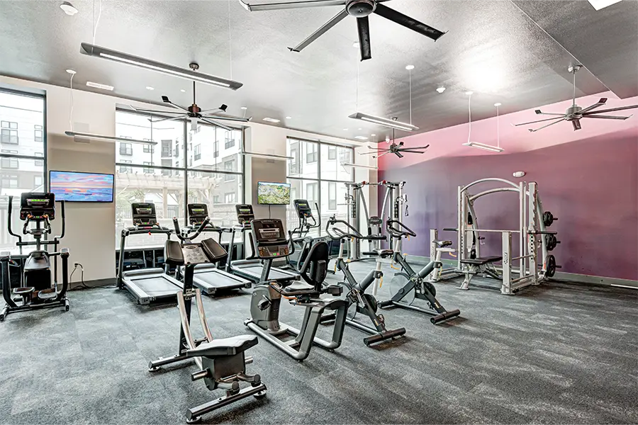 If your college apartment has amenities like this fitness center at Continuum Apartments, it's no wonder you want to renew for another year! Fitness room at Continuum Apartments