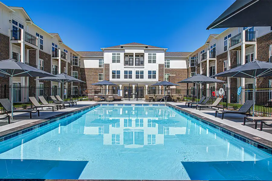 Not sure what a community means by amenities? This pool at Union Street Flats Apartments is one example of an amenity. Pristine pool surrounded by apartment buildings at Union Street Flats Apartments.